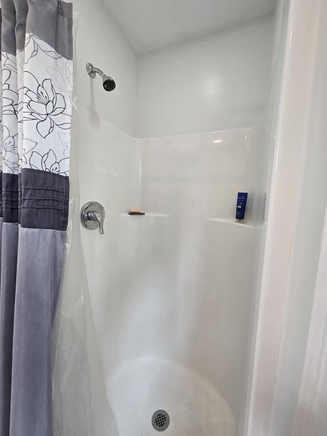 bathroom featuring a stall shower