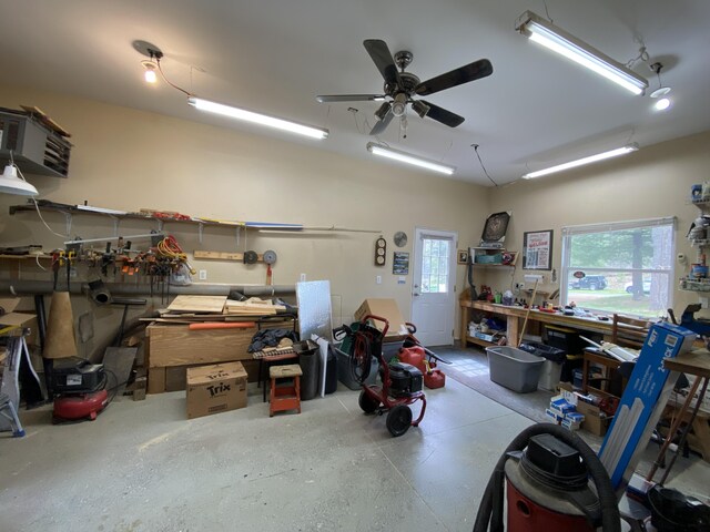 garage featuring a workshop area and ceiling fan
