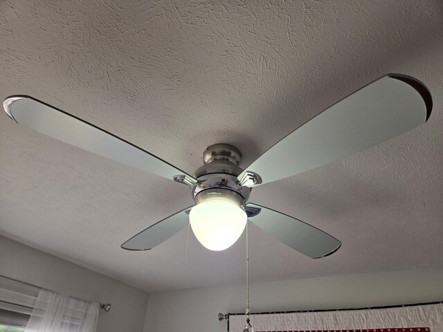detailed view of a textured ceiling and ceiling fan