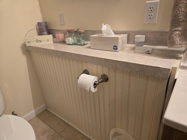 bathroom with tile patterned flooring and toilet