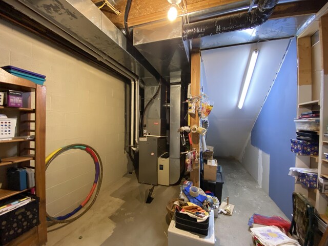 utility room with heating unit