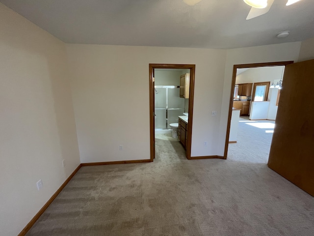 1712 Lisa Dr SW, Byron Center, MI 49315 - empty room with light carpet, baseboards, a smoke detector, and a ceiling fan