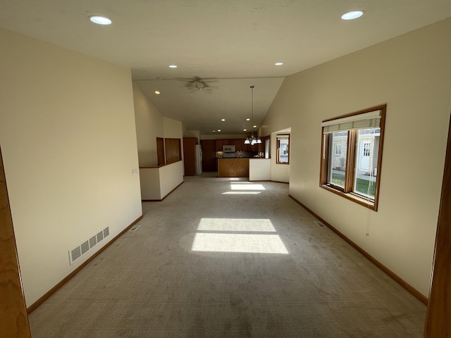 1712 Lisa Dr SW, Byron Center, MI 49315 - unfurnished living room featuring lofted ceiling, light carpet, recessed lighting, baseboards, and ceiling fan