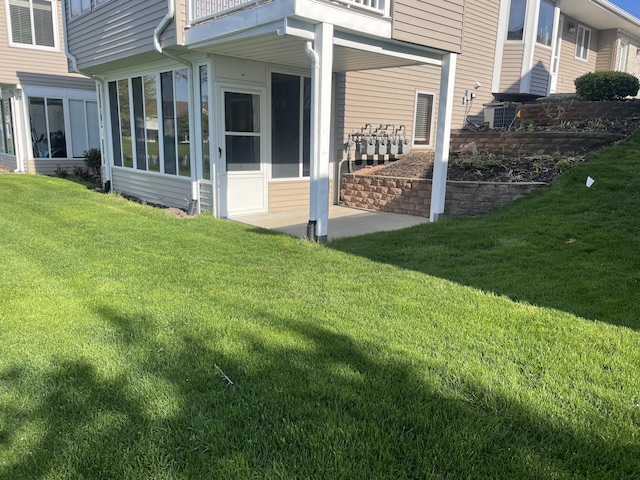 1712 Lisa Dr SW, Byron Center, MI 49315 - view of home's exterior with a yard, a sunroom, and a balcony