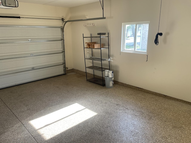 1712 Lisa Dr SW, Byron Center, MI 49315 - garage featuring a garage door opener and baseboards