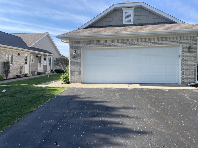 1712 Lisa Dr SW, Byron Center, MI 49315 - view of property exterior with brick siding, a lawn, a garage, and roof with shingles