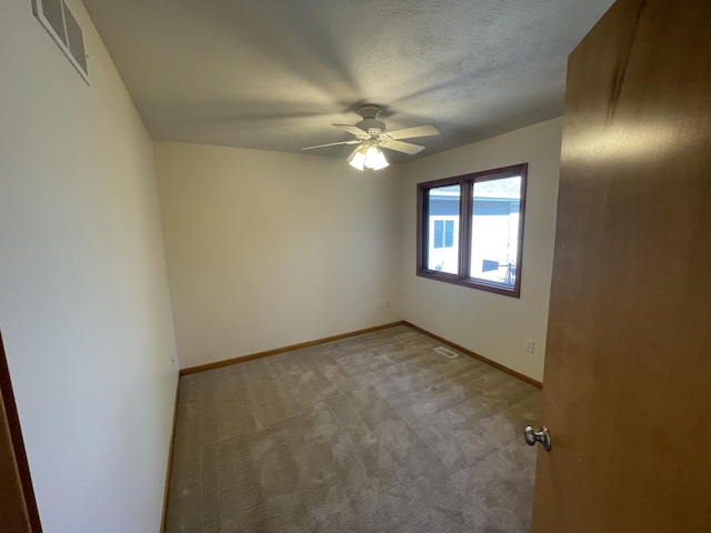 1712 Lisa Dr SW, Byron Center, MI 49315 - spare room featuring light carpet, ceiling fan, and baseboards