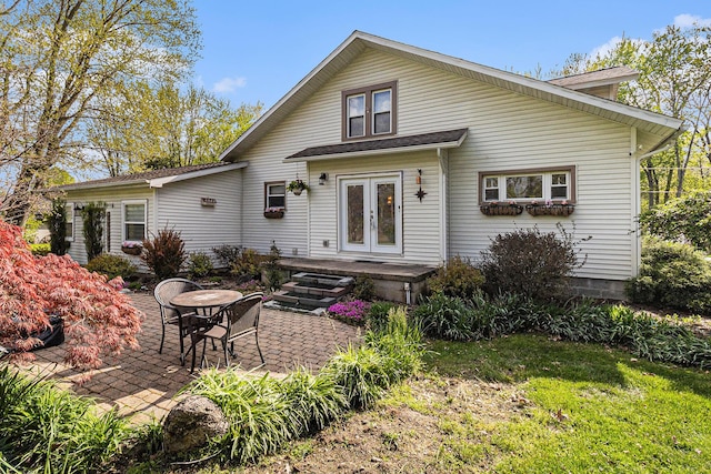 back of property with french doors and a patio area