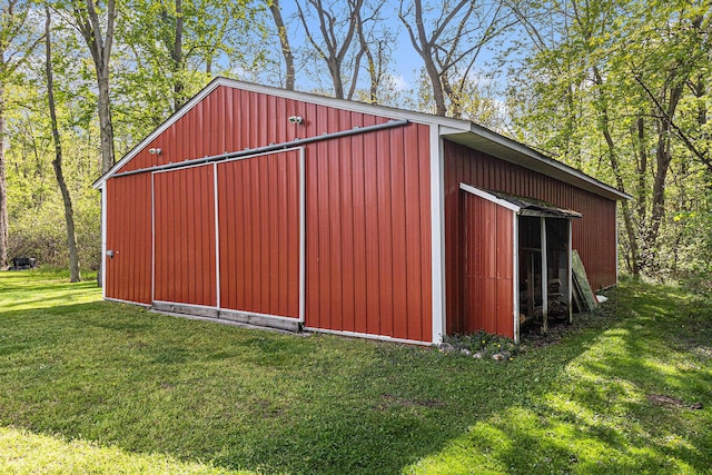 view of pole building with a yard