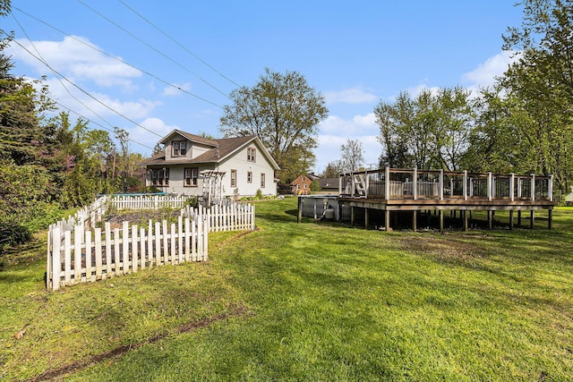 view of yard with a wooden deck