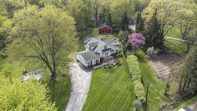view of subject property featuring a forest