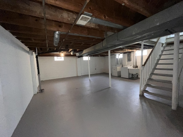 9960 Tecumseh, Redford, MI 48239 - basement featuring washing machine and dryer, stairway, and a sink