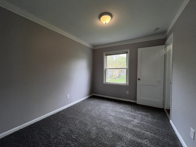 9960 Tecumseh, Redford, MI 48239 - empty room with ornamental molding, dark colored carpet, and baseboards