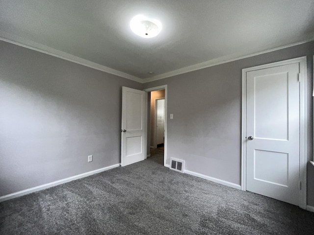 9960 Tecumseh, Redford, MI 48239 - unfurnished bedroom with dark carpet, baseboards, and ornamental molding