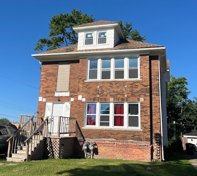 2135 Lakewood St, Detroit, MI 48215 - view of front of home featuring brick siding and a front yard