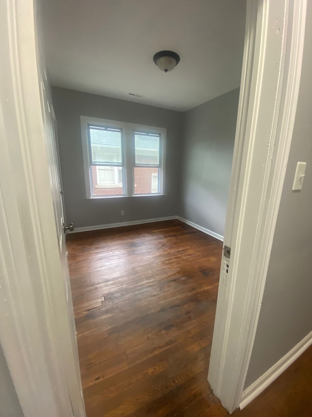 2135 Lakewood St, Detroit, MI 48215 - spare room with dark wood-style flooring and baseboards