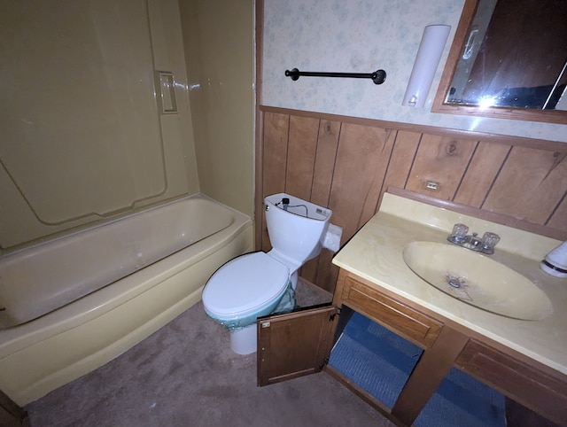 full bathroom with a wainscoted wall, toilet, bathing tub / shower combination, and vanity