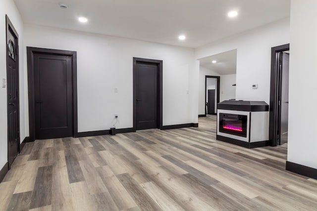 19178 Sherwood St, Detroit, MI 48234 - unfurnished living room featuring light wood-type flooring, recessed lighting, and baseboards