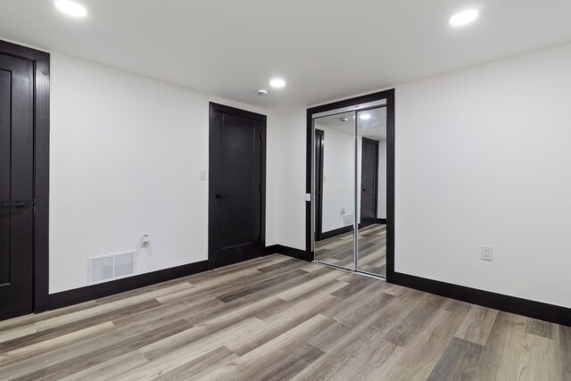 19178 Sherwood St, Detroit, MI 48234 - unfurnished bedroom with light wood-style floors, recessed lighting, a closet, and baseboards