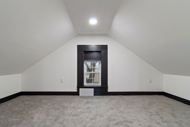 19178 Sherwood St, Detroit, MI 48234 - additional living space with carpet floors, lofted ceiling, and baseboards