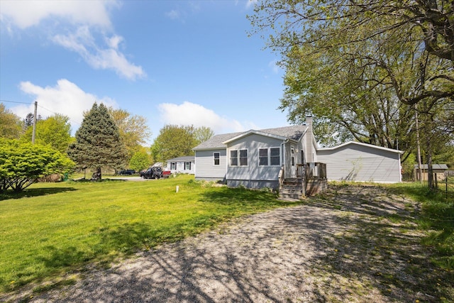 25034 Redfield St, Edwardsburg, MI 49112 - view of front of house featuring a chimney and a front yard