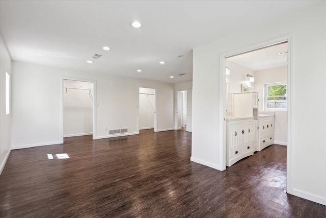 25034 Redfield St, Edwardsburg, MI 49112 - unfurnished living room with dark wood-style flooring, recessed lighting, and baseboards