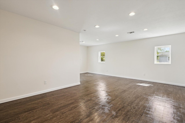 25034 Redfield St, Edwardsburg, MI 49112 - empty room featuring dark wood-style floors, recessed lighting, and baseboards
