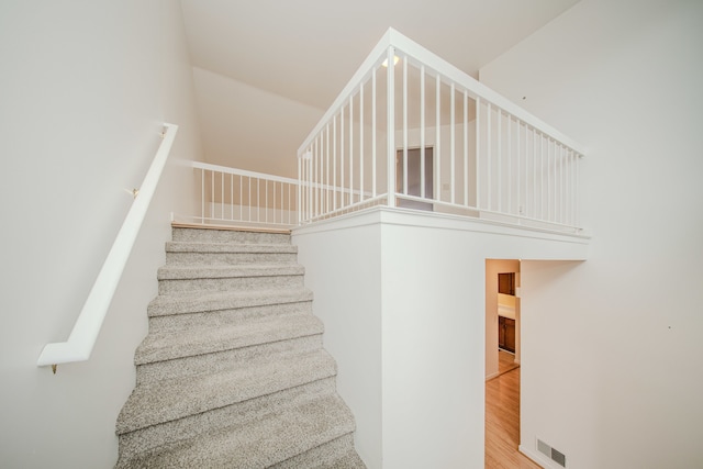 stairway featuring wood finished floors