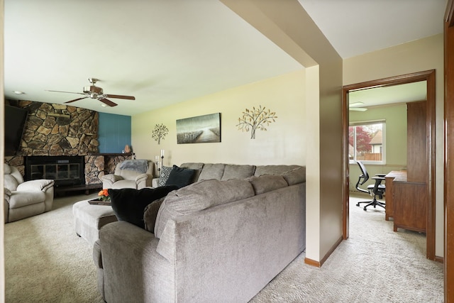 932 E Genesee St, Frankenmuth, MI 48734 - living room with light carpet, ceiling fan, a desk, a fireplace, and baseboards