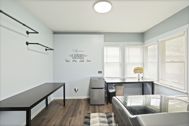 932 E Genesee St, Frankenmuth, MI 48734 - kitchen featuring dark wood-type flooring, plenty of natural light, freestanding refrigerator, and baseboards