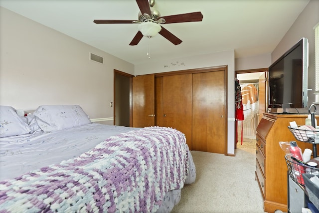932 E Genesee St, Frankenmuth, MI 48734 - bedroom featuring light carpet, a closet, and a ceiling fan