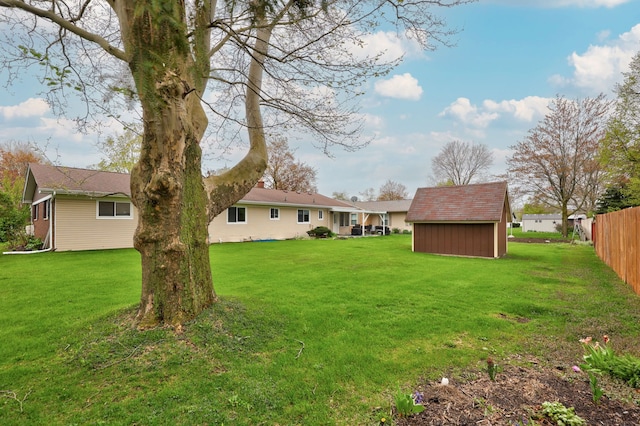 932 E Genesee St, Frankenmuth, MI 48734 - view of yard with a storage shed and an outbuilding
