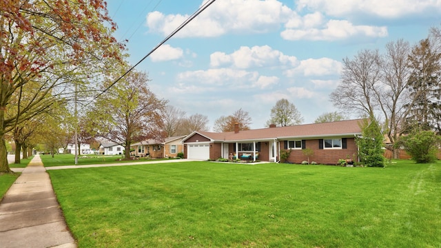 932 E Genesee St, Frankenmuth, MI 48734 - ranch-style house with a garage, driveway, brick siding, a front lawn, and a chimney