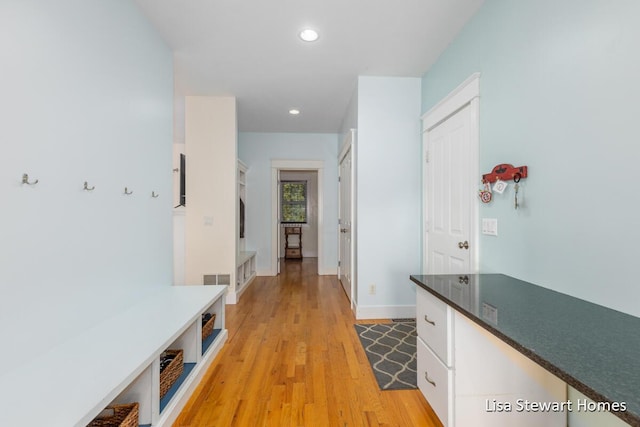 2445 Honey Creek Ave NE, Ada, MI 49301 - mudroom featuring recessed lighting, light wood-style floors, and baseboards