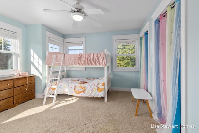 2445 Honey Creek Ave NE, Ada, MI 49301 - bedroom with multiple windows, carpet flooring, and baseboards