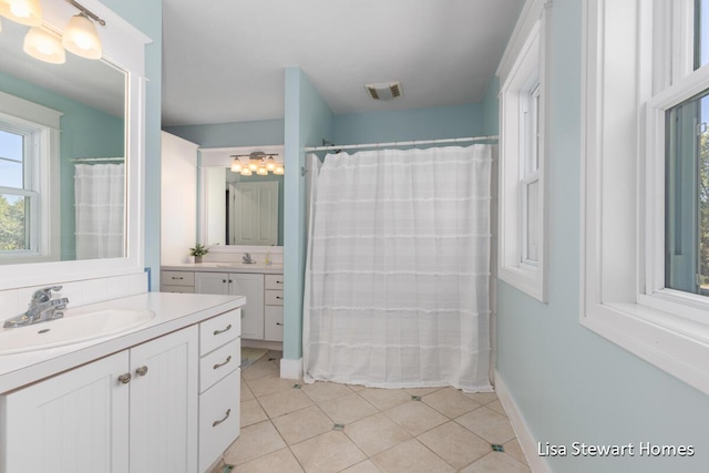 2445 Honey Creek Ave NE, Ada, MI 49301 - bathroom with tile patterned flooring, vanity, and a shower with shower curtain