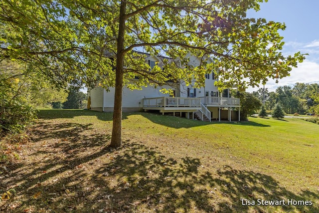 2445 Honey Creek Ave NE, Ada, MI 49301 - view of green lawn with a wooden deck and stairs