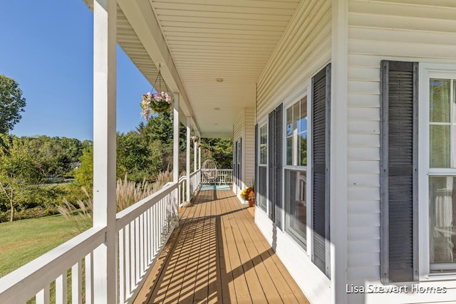 2445 Honey Creek Ave NE, Ada, MI 49301 - balcony featuring covered porch