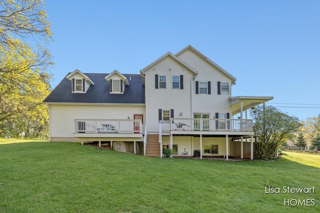 2445 Honey Creek Ave NE, Ada, MI 49301 - back of house with a deck and a yard