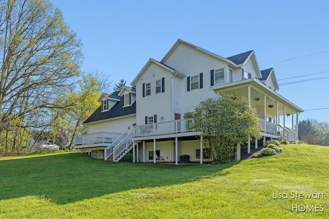2445 Honey Creek Ave NE, Ada, MI 49301 - back of house with a yard, stairway, and a deck