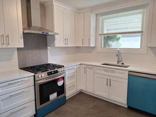 kitchen with dishwasher, gas stove, wall chimney range hood, a sink, and white cabinetry