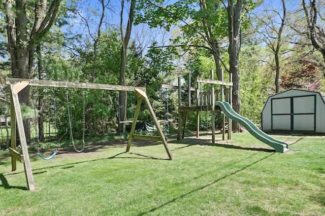 community playground with a yard, a shed, and an outdoor structure