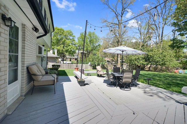 wooden terrace with outdoor dining space