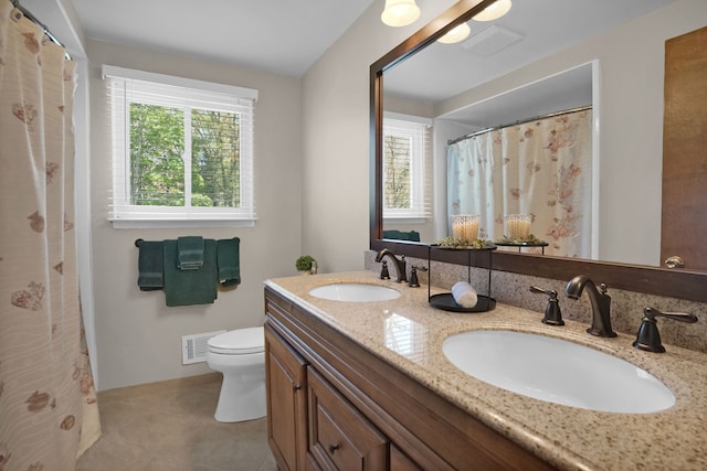 full bath featuring toilet, double vanity, a shower with curtain, and tile patterned floors
