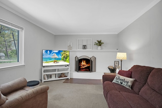carpeted living area featuring a brick fireplace and crown molding