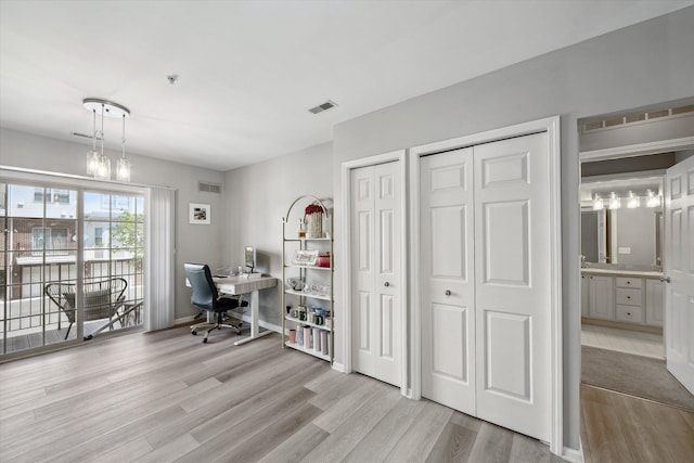 office area with wood finished floors and baseboards