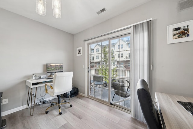 office with wood finished floors and baseboards