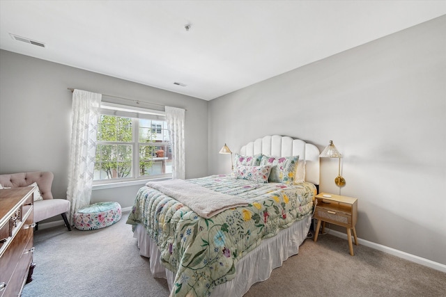 carpeted bedroom with baseboards
