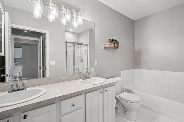 full bath featuring a stall shower, tile patterned floors, a garden tub, double vanity, and toilet