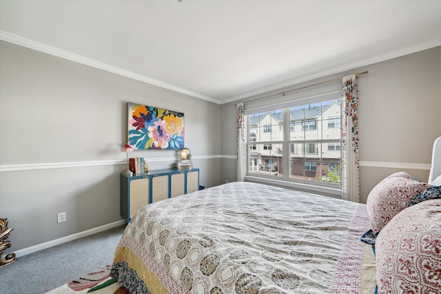 bedroom featuring crown molding, carpet flooring, and baseboards